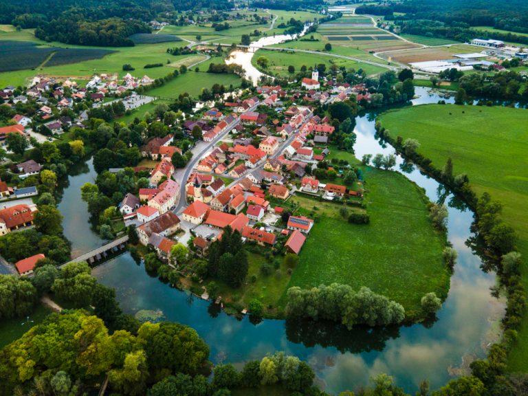Kostanjevica na krki town on river in slovenia aerial photo drone view